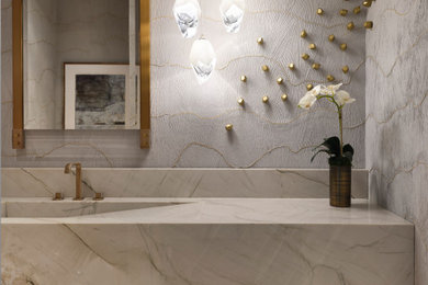 Example of a powder room design in Austin with quartzite countertops