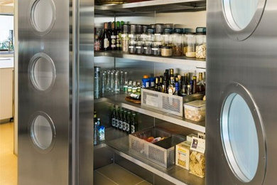 Inspiration for a contemporary ceramic tile kitchen remodel in New York with stainless steel appliances