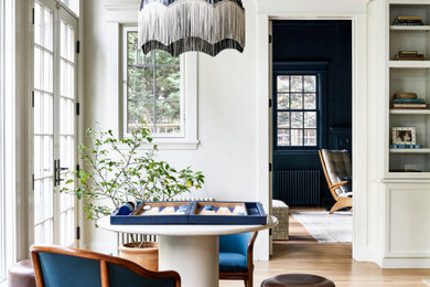 Example of a large transitional coffered ceiling family room design in DC Metro with a media wall