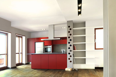 This is an example of a mid-sized contemporary u-shaped open plan kitchen in Rome with a double-bowl sink, flat-panel cabinets, red cabinets, quartzite benchtops, grey splashback, stainless steel appliances, dark hardwood floors and with island.