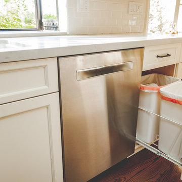 Sleek Stainless Steel Dishwasher Next to Pull-out Trash