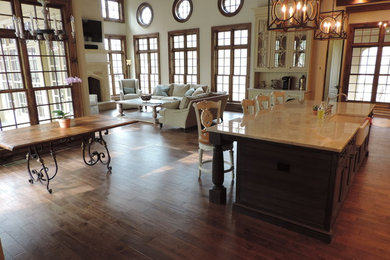 Family room - mid-sized rustic open concept dark wood floor family room idea in Atlanta with a wall-mounted tv
