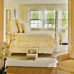 Example of a classic bedroom design in Baltimore with yellow walls