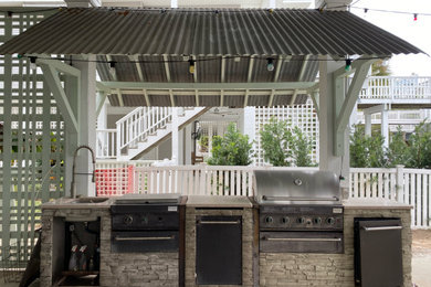 Example of a beach style patio design in Houston