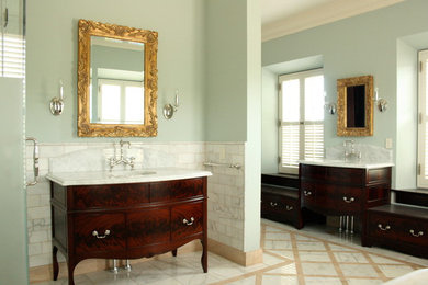 This is an example of a mid-sized traditional master bathroom in Boise with flat-panel cabinets, dark wood cabinets, a freestanding tub, white tile, marble, grey walls, marble floors, an undermount sink, marble benchtops, white floor and white benchtops.