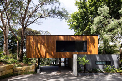 Design ideas for a contemporary house exterior in Sydney with a flat roof.