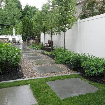 Side yard garden walkway / path with bluestone steppers.