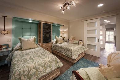 Example of a mid-sized classic light wood floor bedroom design in Phoenix with beige walls