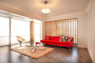 Photo of a contemporary living room in Sydney with concrete floors.