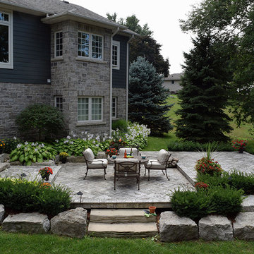 A stone deck built on steel substructure and a covered porch deck in Veka vinyl.