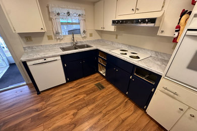 Inspiration for a mid-sized eat-in kitchen remodel in Other with laminate countertops, no island and gray countertops