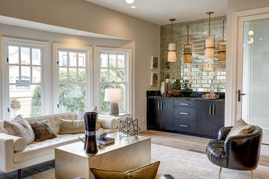 Living room - mid-sized transitional open concept medium tone wood floor and brown floor living room idea in Other with a bar and beige walls
