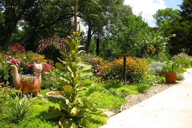 Photo of a mid-sized craftsman full sun backyard landscaping in Oklahoma City for summer.