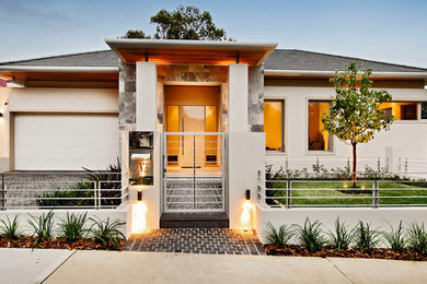 Photo of a contemporary one-storey beige exterior in Perth.