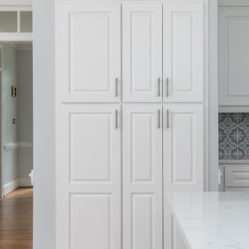 Sleek Modern Kitchen Remodel with White Cabinets & Grey Mosaic Backsplash
