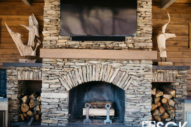 Mountain style backyard patio photo in Other