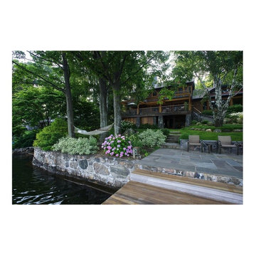 Lake view of landscape plantings and stone