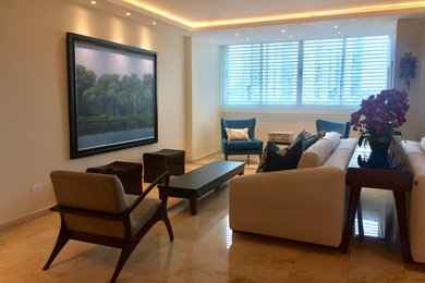 Living room - mid-sized contemporary formal and enclosed marble floor living room idea in Other with beige walls and a media wall