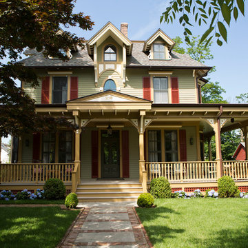 New front facade with expanded porch.  Original details saved and also replicate