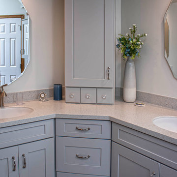 Waypoint Gray Shaker Door Cabinetry with Tiled Shower and Matching Tub Surround