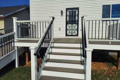 This is an example of a medium sized modern side metal railing terrace in DC Metro.
