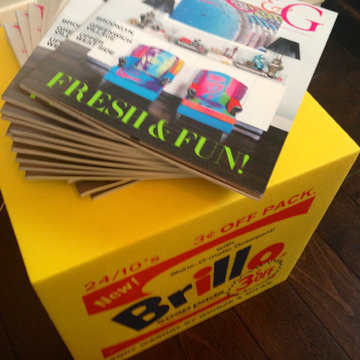 The magazines stacked atop an Andy-inspired Brillo ottoman.