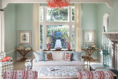 Living room - coastal formal living room idea in Seattle with a standard fireplace and green walls