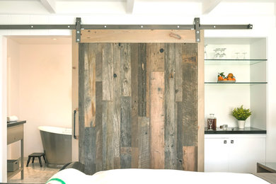 Example of a country bedroom design in Other