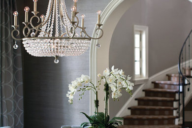 Inspiration for a mid-sized timeless dark wood floor great room remodel in Other with gray walls and no fireplace