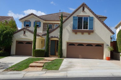 Large southwest beige two-story mixed siding exterior home photo in San Diego