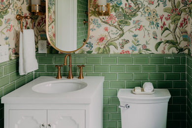 Example of a small classic green tile and ceramic tile mosaic tile floor, white floor, single-sink and wallpaper bathroom design in Detroit with white cabinets, green walls, white countertops and a freestanding vanity