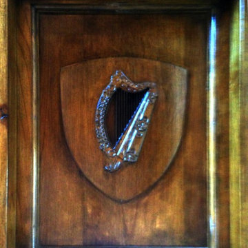 custom designed and built alder door with custom carved family crest panels