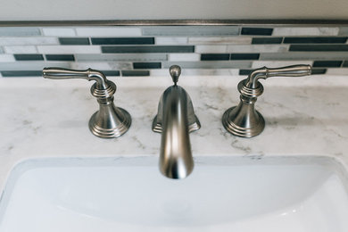 Mid-sized trendy master blue tile and glass tile porcelain tile and beige floor alcove shower photo in Boston with black cabinets, a one-piece toilet, beige walls, a drop-in sink, wood countertops and a hinged shower door