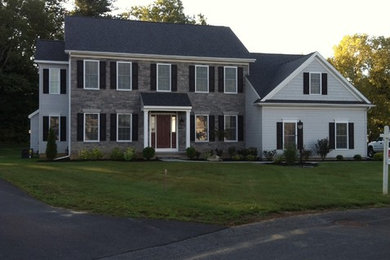 Mid-sized elegant blue two-story mixed siding exterior home photo in Boston