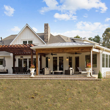 French country, lodge-style riverfront home