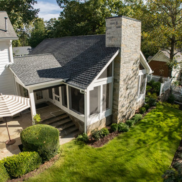 Custom Screened Porch with Stone Chimney & Landscape Integration