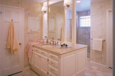 Design ideas for a large traditional master bathroom in Denver with raised-panel cabinets, white cabinets, a drop-in tub, beige tile, porcelain tile, beige walls, ceramic floors, an undermount sink, engineered quartz benchtops and brown floor.