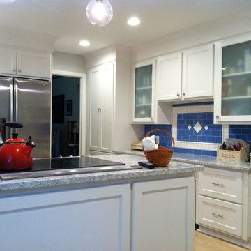 Shaker Style Cabinets with Crown Molding and Gray Granite Countertops