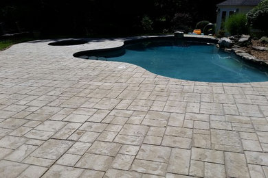 Design ideas for a traditional patio in Boston with stamped concrete.