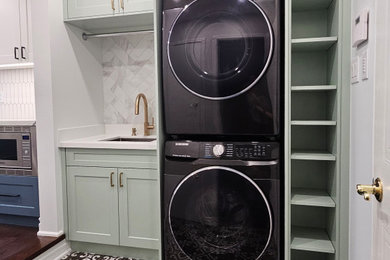 Transitional laundry room photo in Toronto