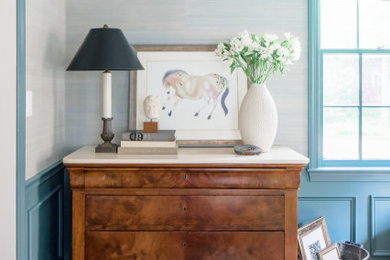 Living room library - traditional enclosed medium tone wood floor, brown floor and wallpaper living room library idea in DC Metro with blue walls