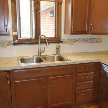 Kitchen Reconfigured to Brightens and Expand Storage