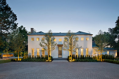 Transitional white two-story exterior home idea in San Francisco with a hip roof