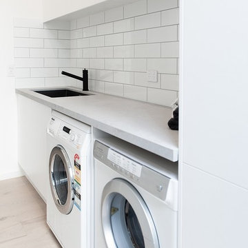 Laundry with side by side washer dryer