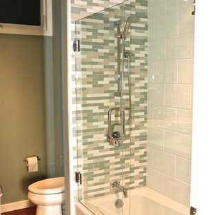 Bathroom - small contemporary blue tile and glass tile bamboo floor bathroom idea in Other with a vessel sink, a one-piece toilet and green walls