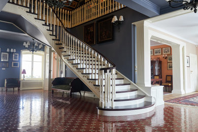 Inspiration for a victorian terra-cotta tile and brown floor hallway remodel in Other with blue walls