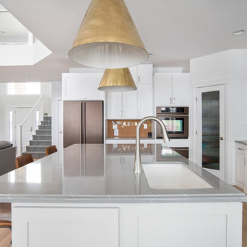 Sleek Modern Contemporary Kitchen w/ White Cabinets, Gray Quartz & Gold Accents
