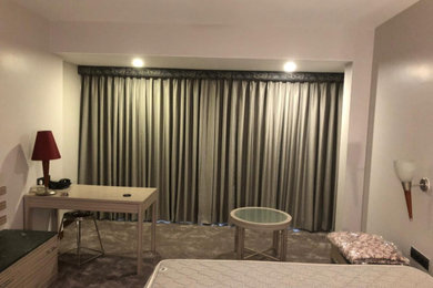 Example of a minimalist bedroom design in Other