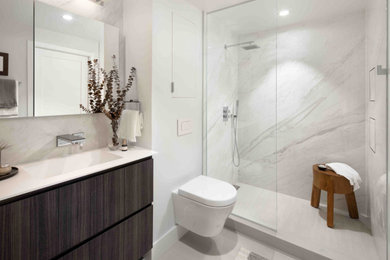 Trendy stone slab porcelain tile, gray floor and single-sink bathroom photo in DC Metro with flat-panel cabinets, dark wood cabinets, a wall-mount toilet, white walls, solid surface countertops, white countertops, a niche and a floating vanity