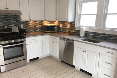 Beach style kitchen in New York.